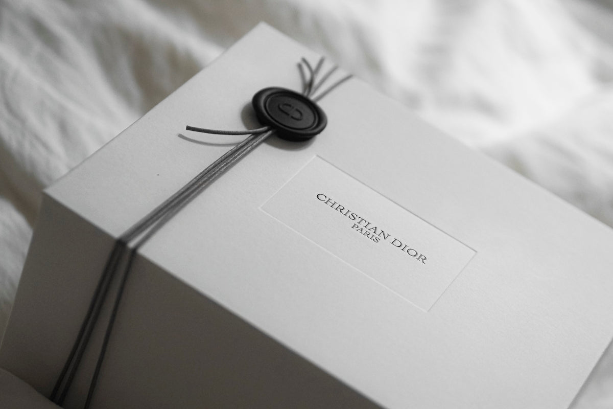 White dior gift box with wax seal and ribbon