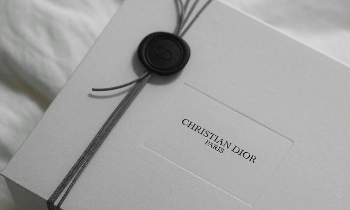 White christian dior gift box with ribbon and wax seal