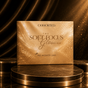 A square cosmetic-style box or book cover standing upright on a round metallic pedestal, with the text 'COHORTED THE SOFT FOCUS Glow EDIT' and 'PAT McGRATH LABS' visible. The design is predominantly warm metallic gold and bronze with glowing light effects, set against a dark draped background with gold highlights.
